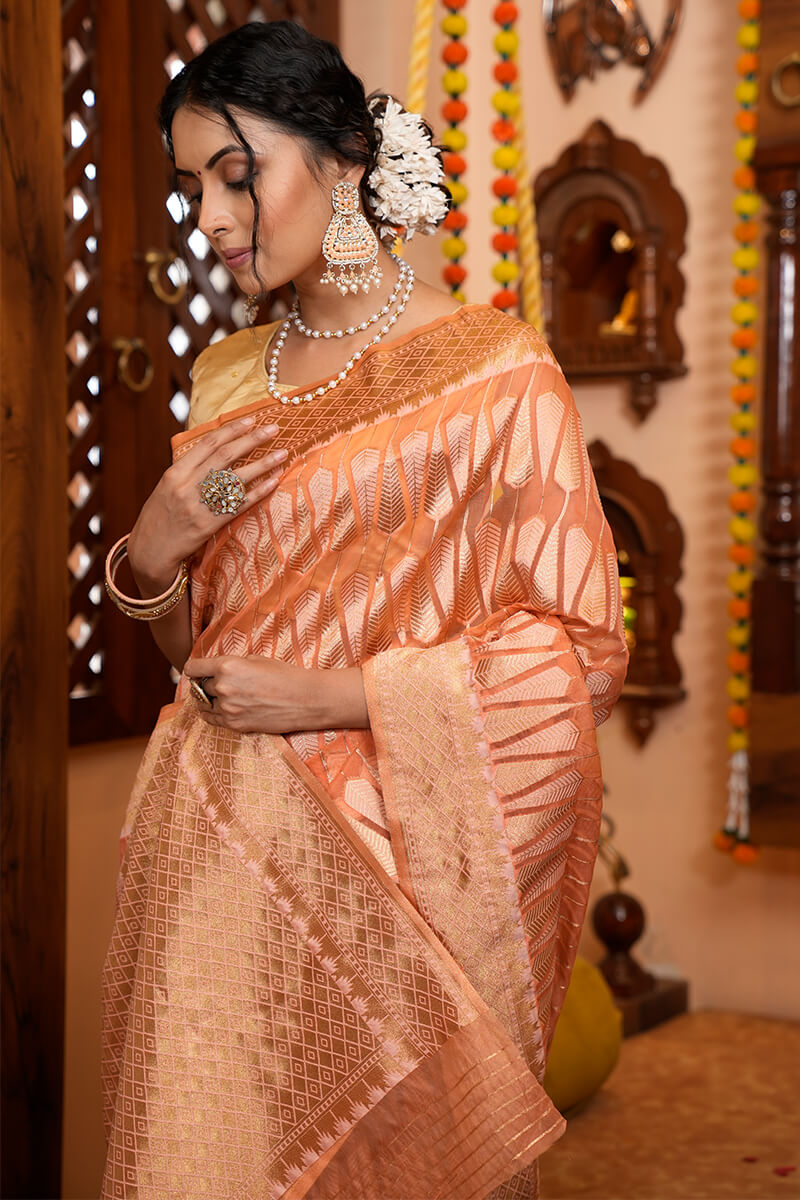 Artistic Peach Organza Silk Saree With Snappy Blouse Piece