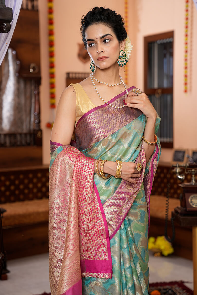 Quintessential Firozi Organza Silk Saree With Palimpsest Blouse Piece