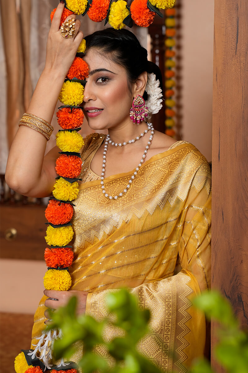 Radiant Yellow Organza Silk Saree With Mesmeric Blouse Piece
