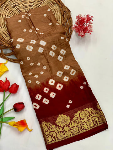A glam Brown Bandhani Silk Saree With Exquisite Blouse Piece