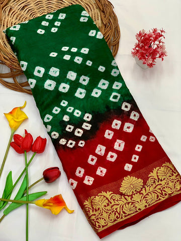 dreamy Dark Green Bandhani Silk Saree With Exquisite Blouse Piece
